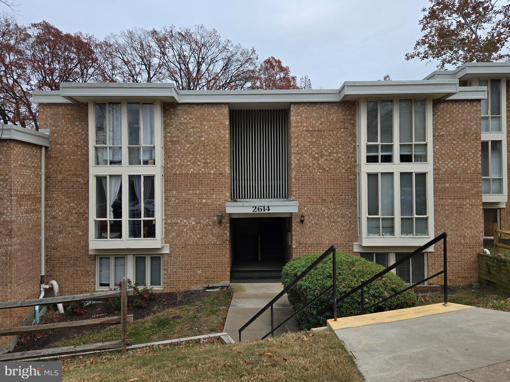 a front view of a house with yard