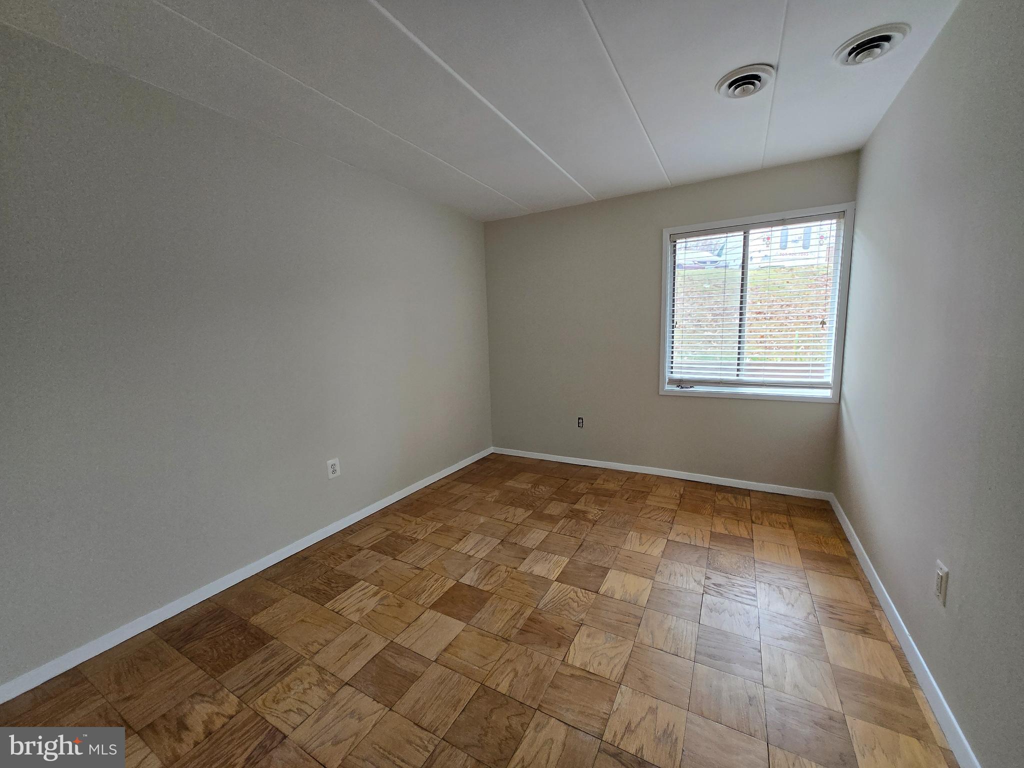 2614 Fort Farnsworth Road, Unit 254 Alexandria, VA 22303 - Photo 6 of 11 an empty room with windows