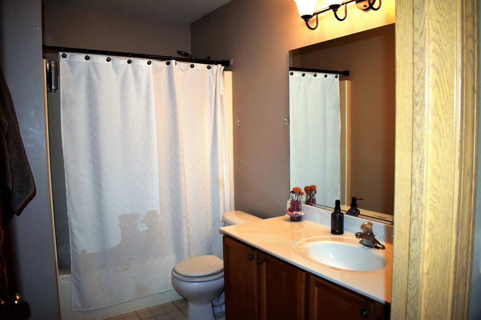 605 Chestnut Ridge Minooka, IL 60447 - Photo 13 of 16 a bathroom with a granite countertop sink toilet and a mirror