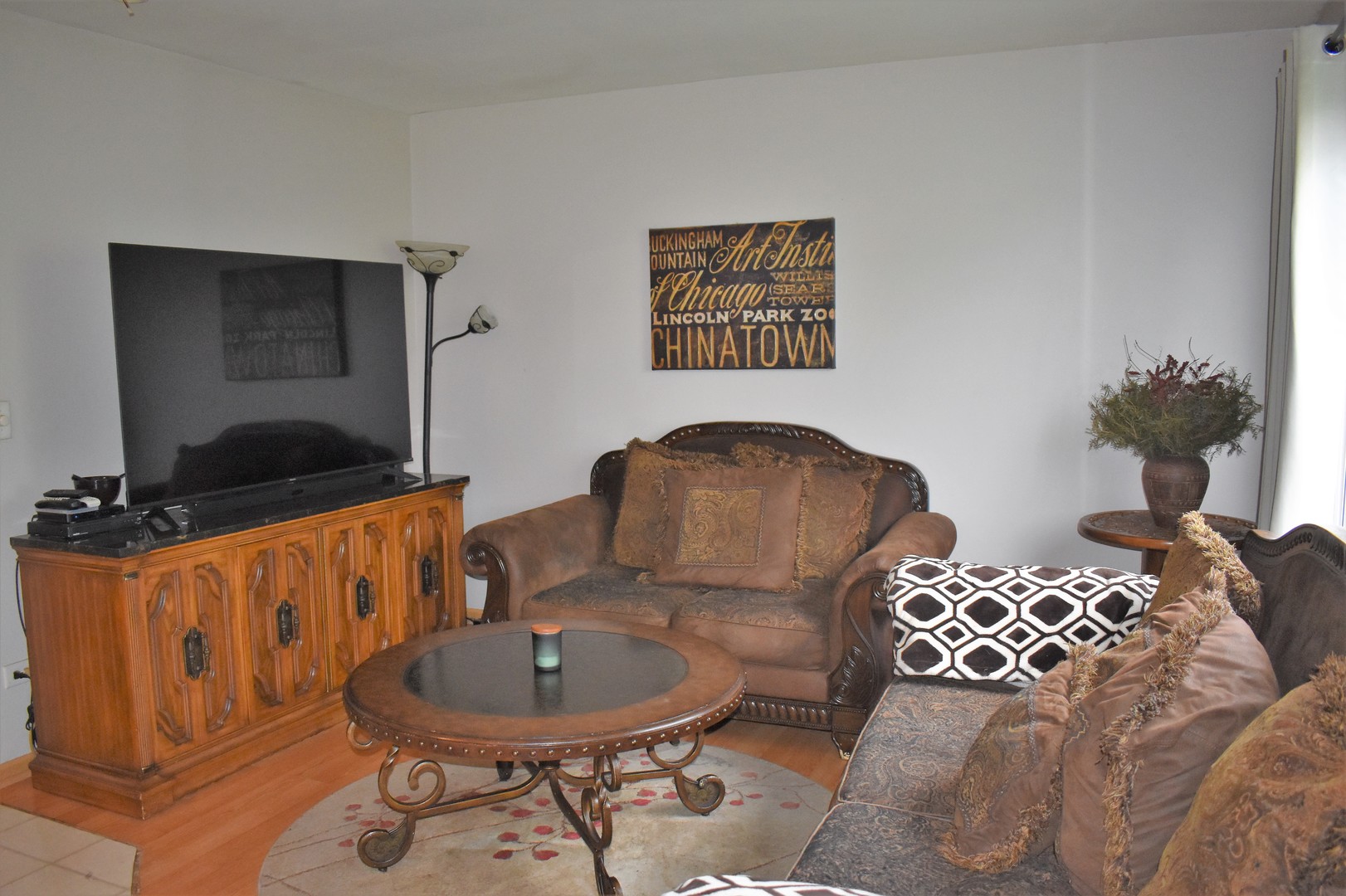 605 Chestnut Ridge Minooka, IL 60447 - Photo 7 of 16 a living room with furniture and a flat screen tv