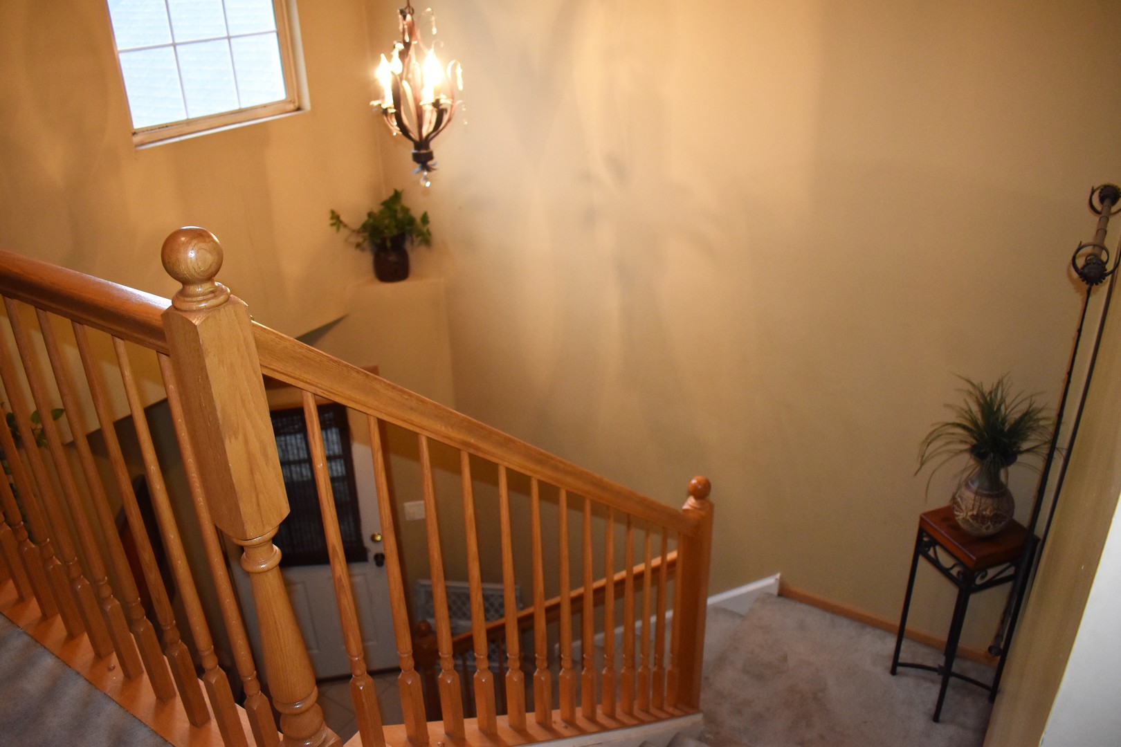 605 Chestnut Ridge Minooka, IL 60447 - Photo 10 of 16 a view of staircase with railing and a window
