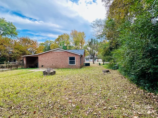 a backyard of a house with lots of green space