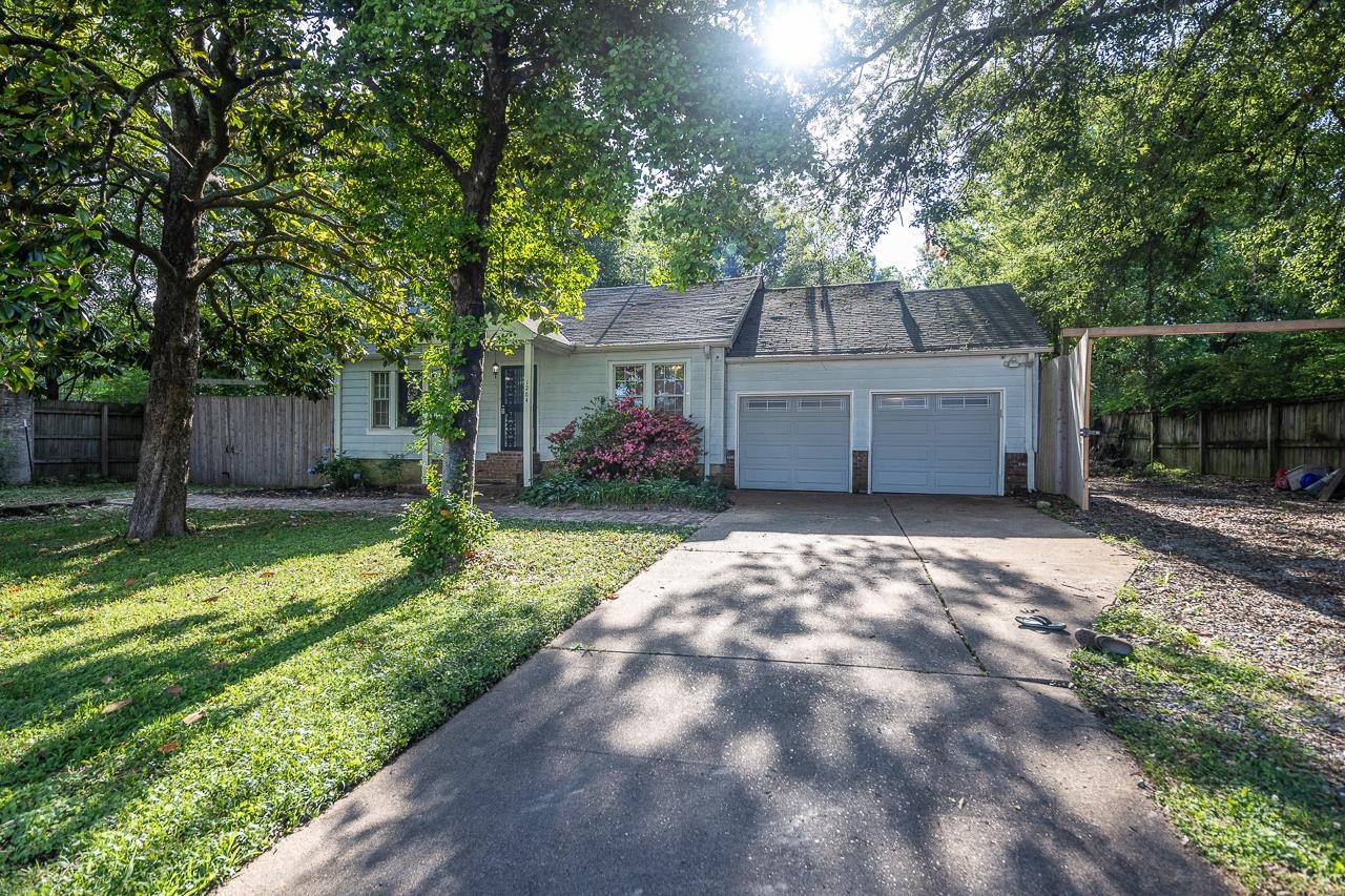 1264 Dovecrest Road Memphis, TN 38134 - Photo 1 of 30 a front view of a house with garden