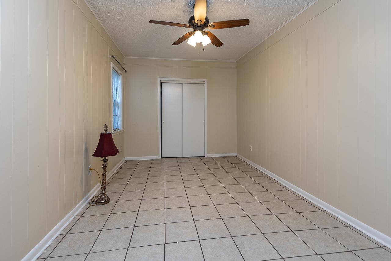 1264 Dovecrest Road Memphis, TN 38134 - Photo 14 of 30 a view of an empty room and chandelier fan