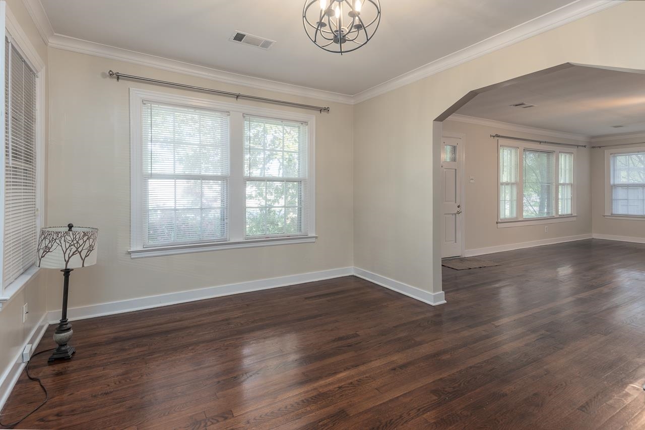 1264 Dovecrest Road Memphis, TN 38134 - Photo 16 of 30 a view of an empty room with wooden floor and a window