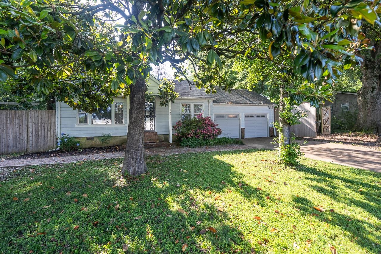1264 Dovecrest Road Memphis, TN 38134 - Photo 2 of 30 a front view of house with yard and green space