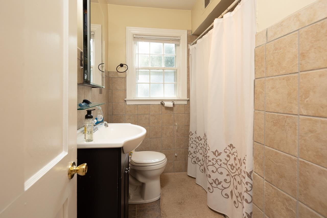 1264 Dovecrest Road Memphis, TN 38134 - Photo 21 of 30 a bathroom with a sink toilet and shower