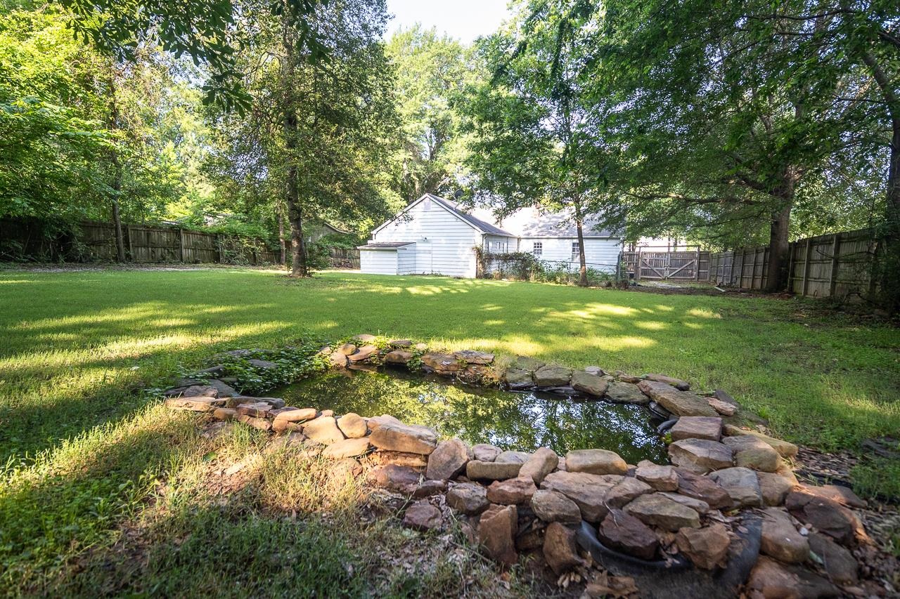 1264 Dovecrest Road Memphis, TN 38134 - Photo 25 of 30 a view of a house with a yard and large trees