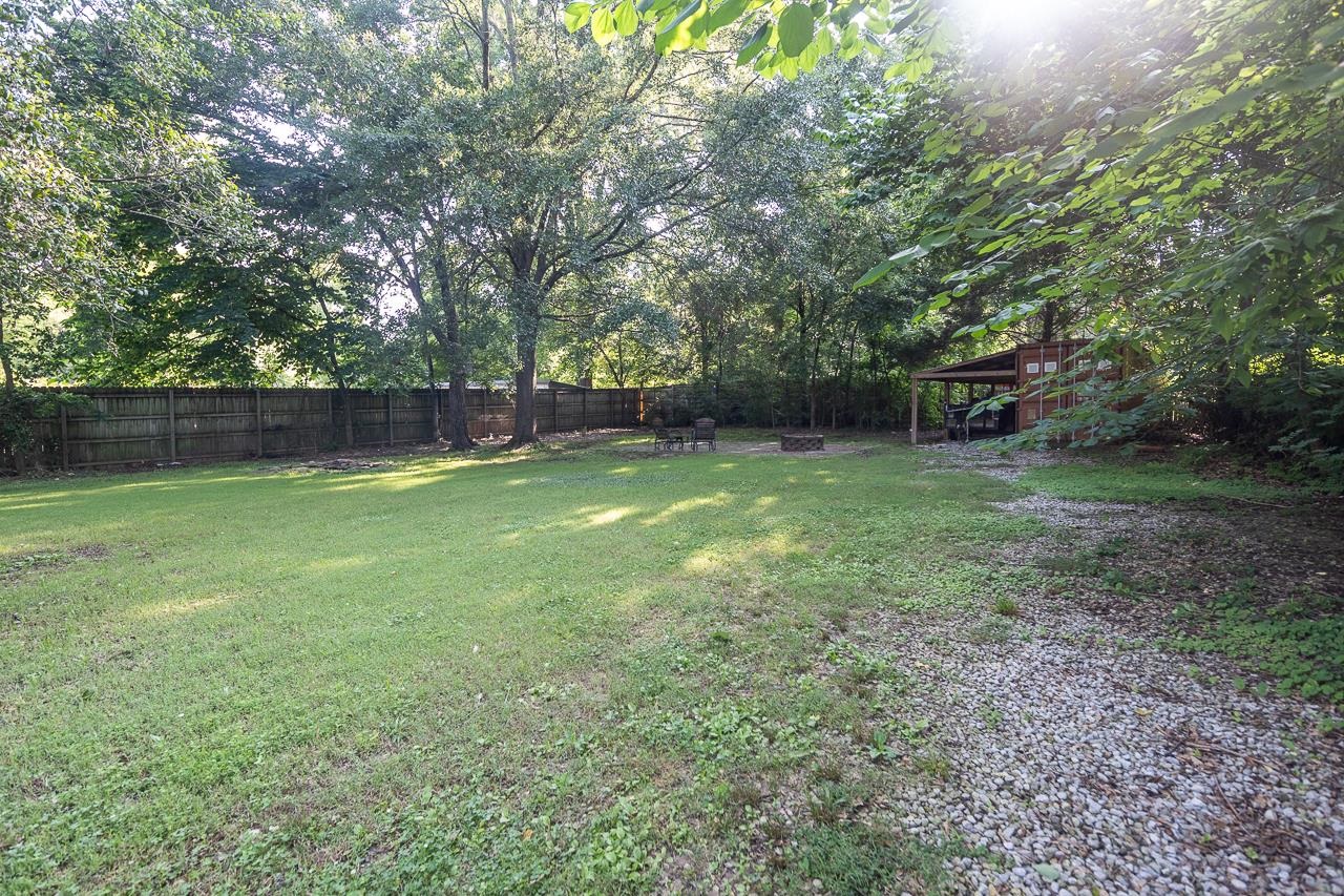 1264 Dovecrest Road Memphis, TN 38134 - Photo 26 of 30 a view of a backyard with a large tree