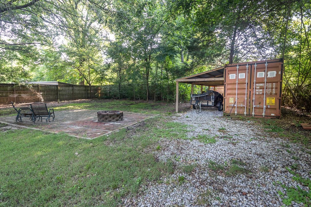 1264 Dovecrest Road Memphis, TN 38134 - Photo 27 of 30 a view of a backyard with furniture