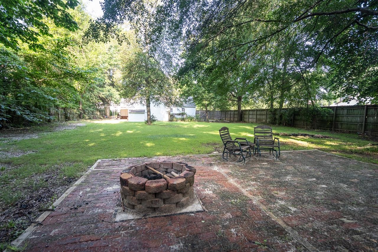 1264 Dovecrest Road Memphis, TN 38134 - Photo 29 of 30 a view of a table and chairs in the garden