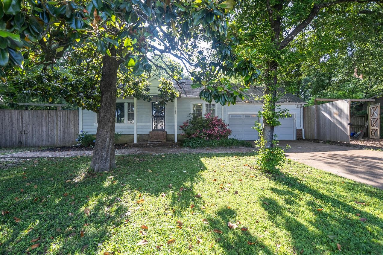 1264 Dovecrest Road Memphis, TN 38134 - Photo 3 of 30 a front view of a house with garden