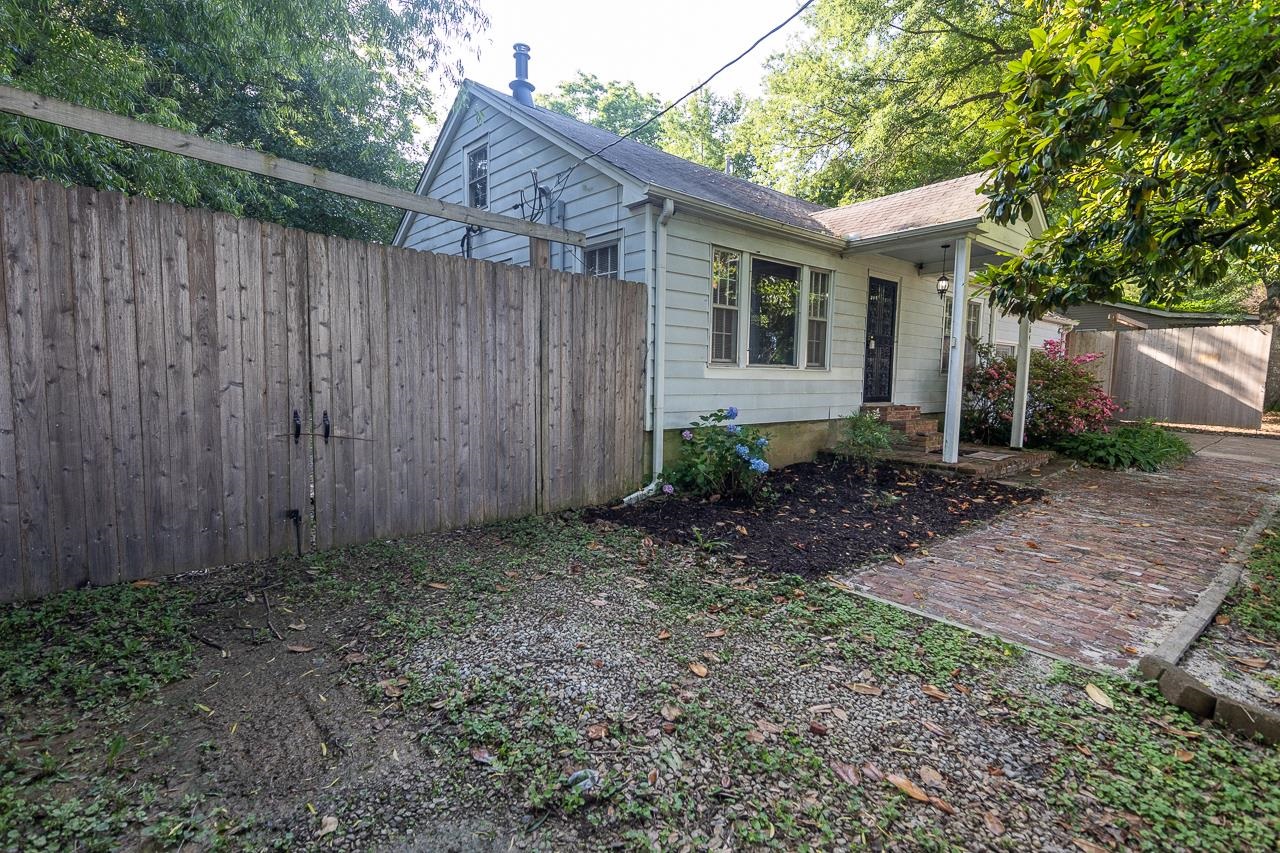 1264 Dovecrest Road Memphis, TN 38134 - Photo 5 of 30 a view of a house with backyard and wooden fence