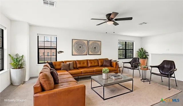 a living room with furniture and a window