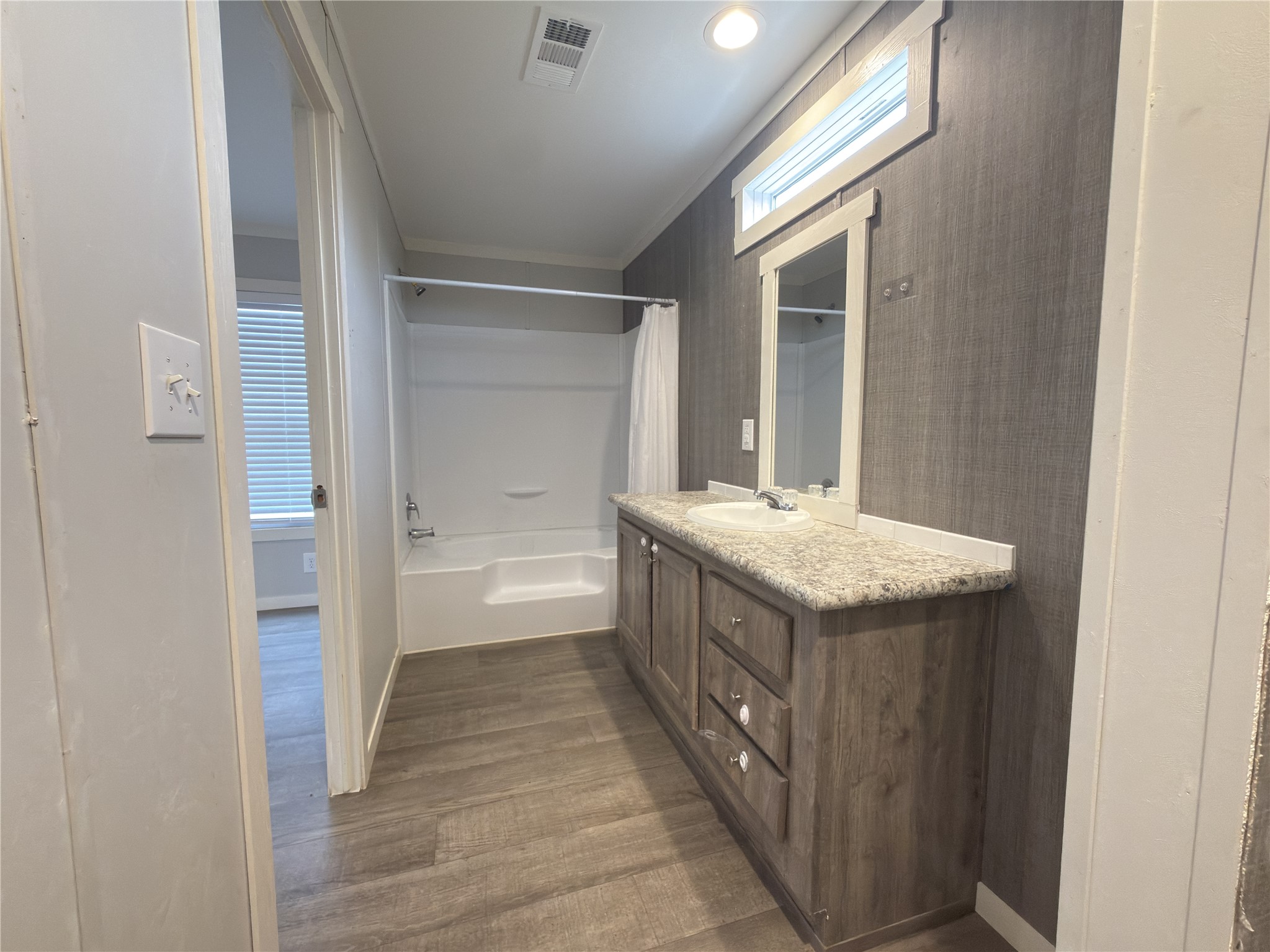 102 Road 5118 Cleveland, TX 77327 - Photo 11 of 16 a bathroom with a granite countertop sink and a mirror