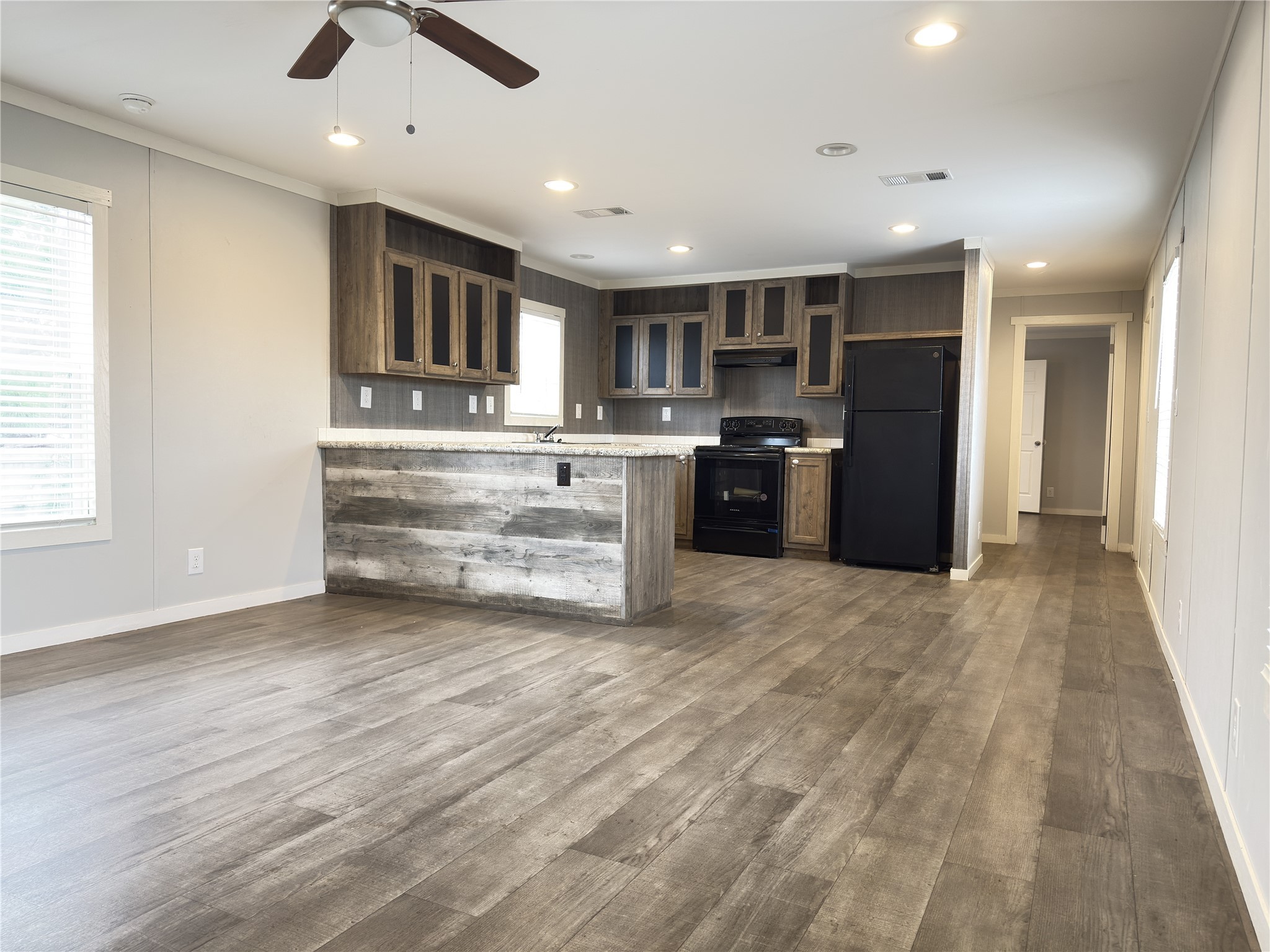 102 Road 5118 Cleveland, TX 77327 - Photo 5 of 16 a view of kitchen with sink microwave and refrigerator