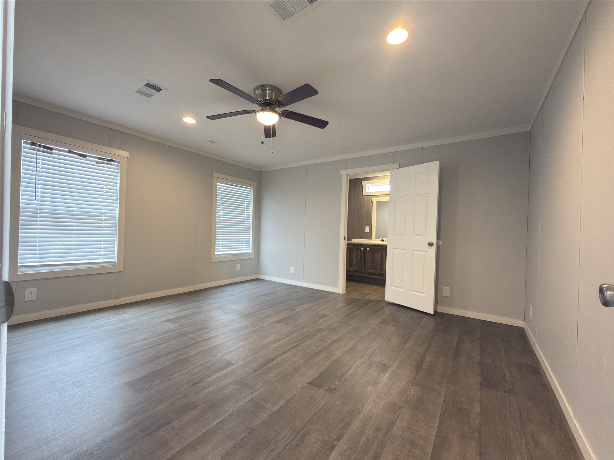 102 Road 5118 Cleveland, TX 77327 - Photo 9 of 16 a view of empty room with wooden floor and fan