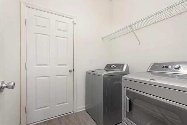 a utility room with dryer and washer
