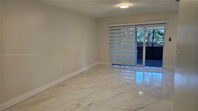 a view of room with window and hardwood floor