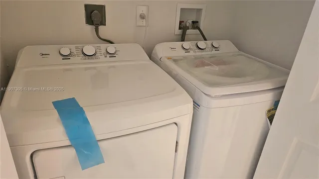 a utility room with dryer and washer
