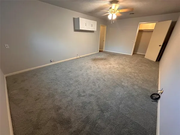 an empty room with a mirror