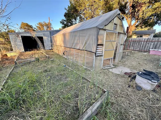 a view of a backyard with a small yard