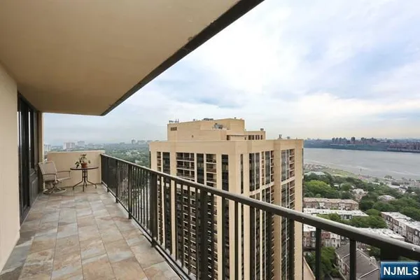 a view of balcony with city and ocean view