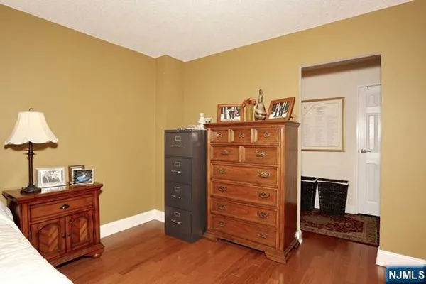 a living room with furniture wooden floor and a flat screen tv