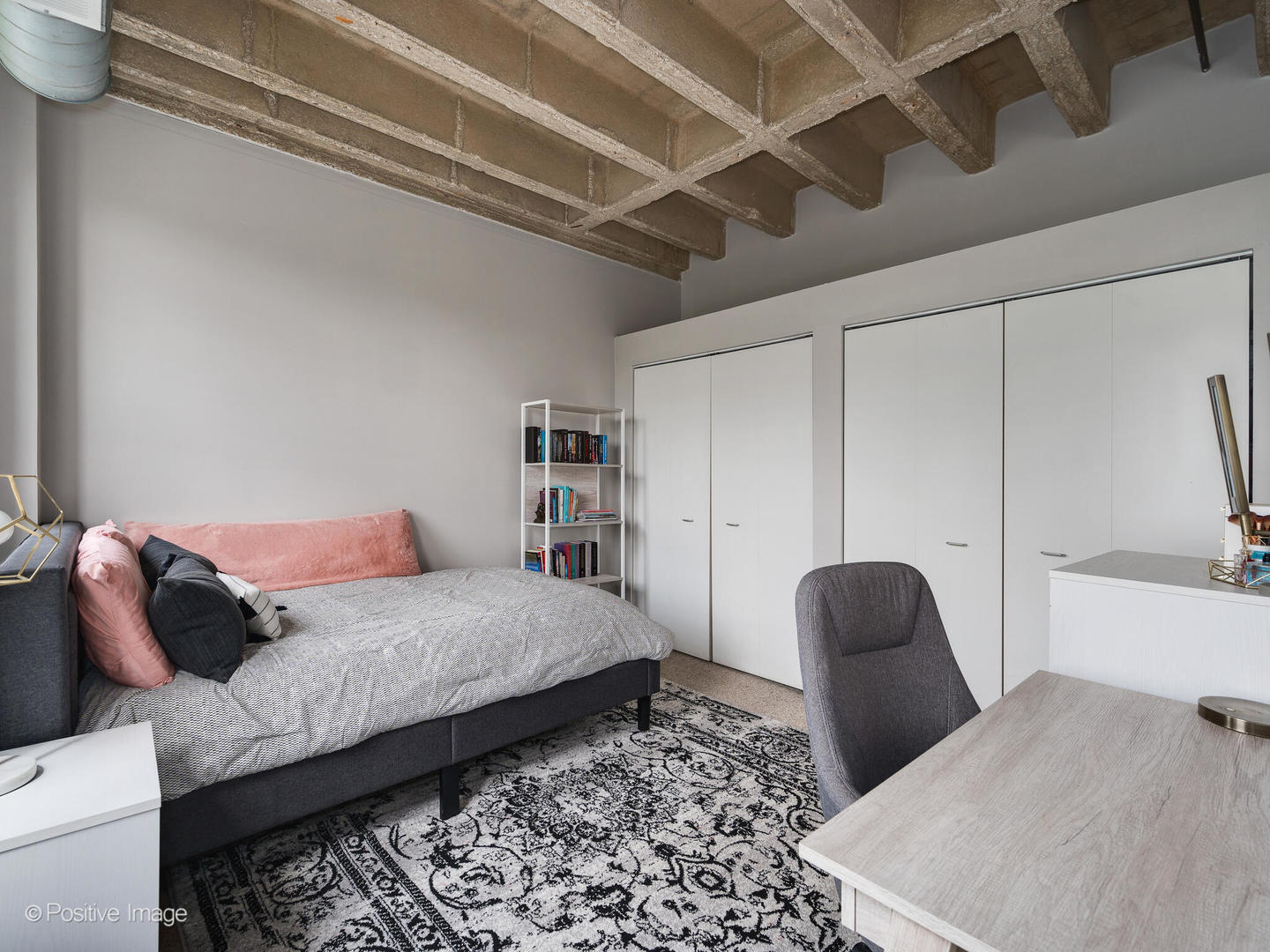 811 South Lytle Street, Unit 303 Chicago, IL 60607 - Photo 14 of 17 a bedroom with a bed and a couch