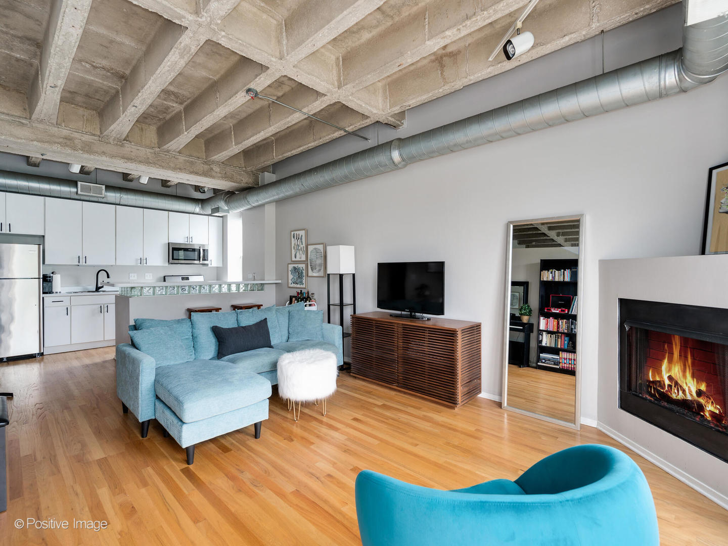 811 South Lytle Street, Unit 303 Chicago, IL 60607 - Photo 10 of 17 a living room with furniture and a flat screen tv