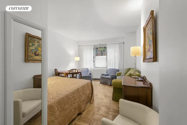 a room with a sink a stove a washer dryer and a window