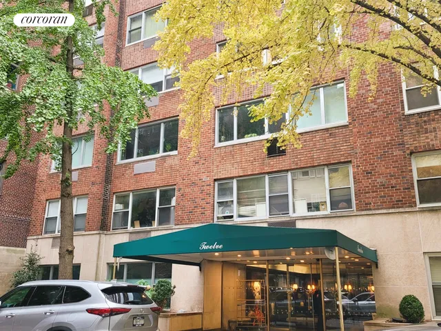 a view of a patio with a table and chairs and potted plants