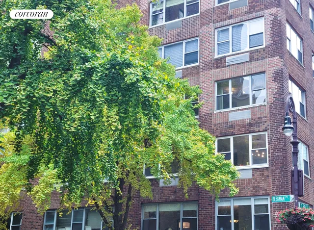 a view of a cars park in front of a house