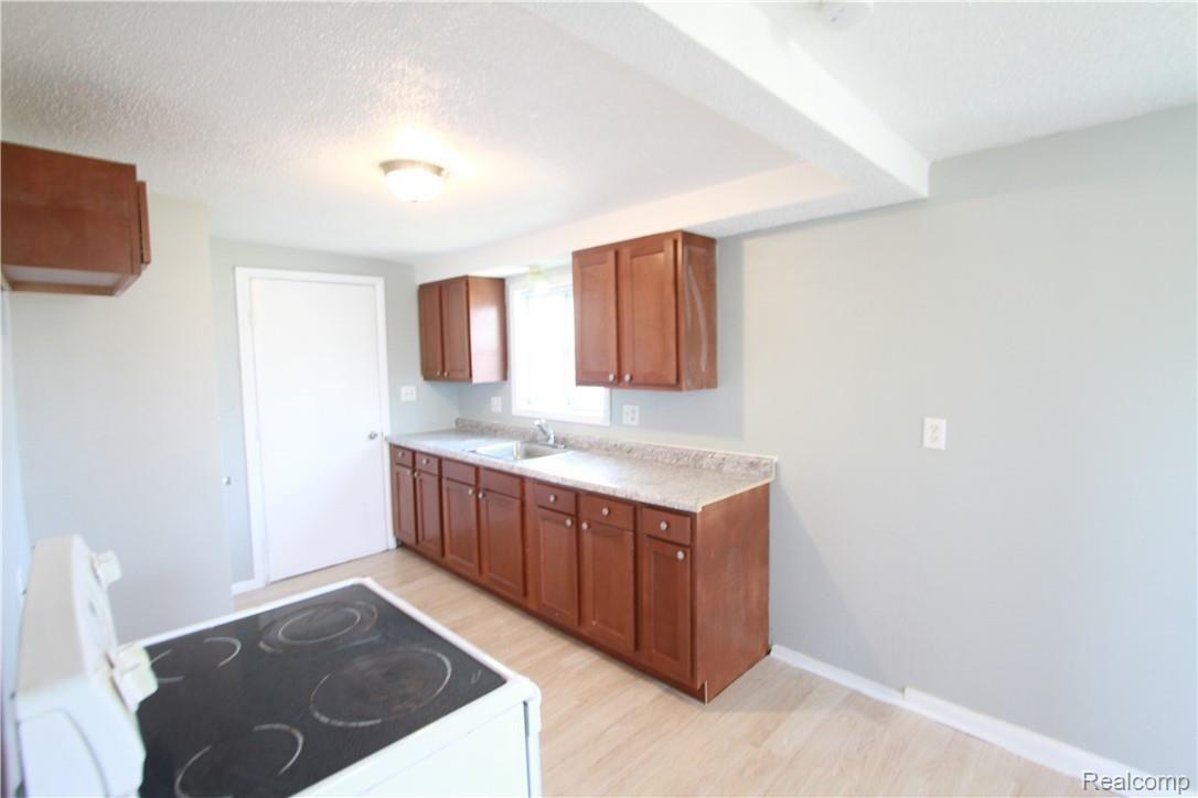 4226 Venoy Road Wayne, MI 48184 - Photo 30 of 37 upstairs kitchen with plastic still on new cabinets