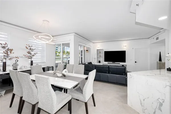 a living room with furniture and a lamp