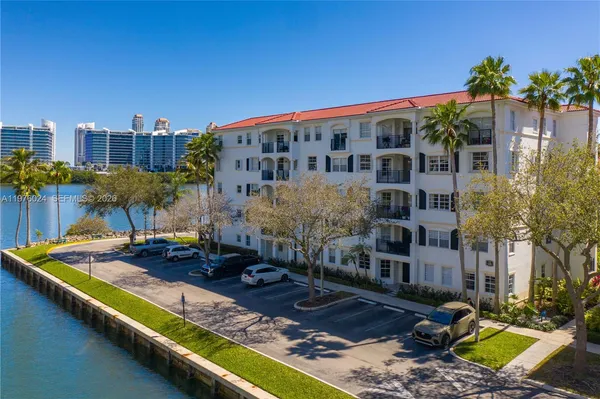 an aerial view of a house with a lake view