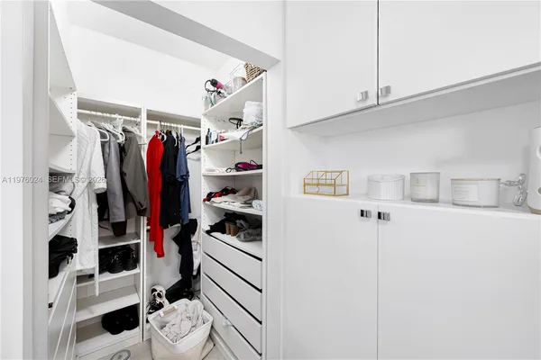 a bathroom with a shower sink and mirror