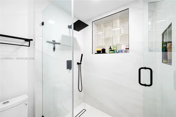 a front view of a house with seating space