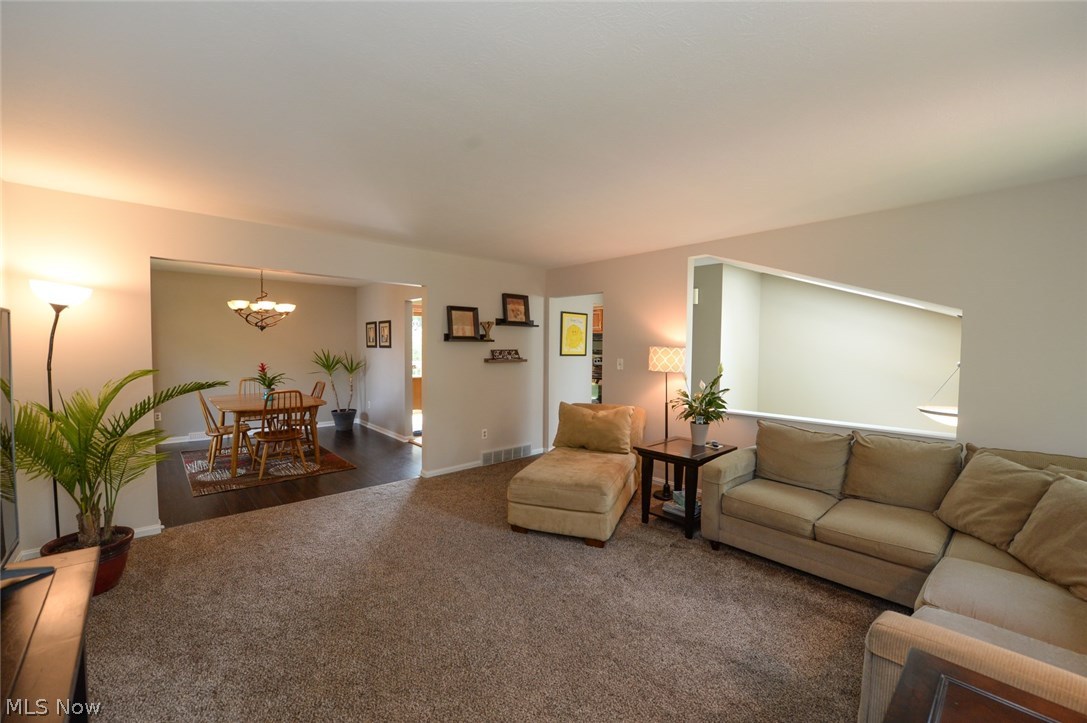347 Silver Ridge Drive Akron, OH 44321 - Photo 7 of 31 This large open living room offers plenty of space to relax and to entertain. It features lush neutral carpet and neutral paint to create a calm, relaxing environment!