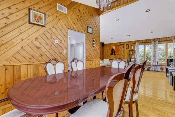 a view of a swimming pool with a couches and chairs