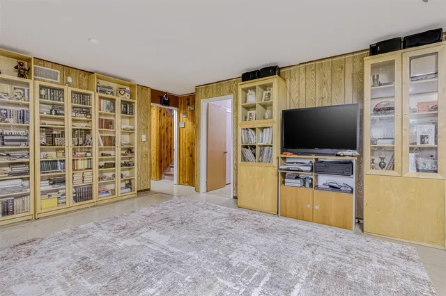a view of livingroom with furniture and a flat screen tv