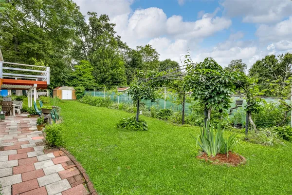 a backyard of a house with lots of green space