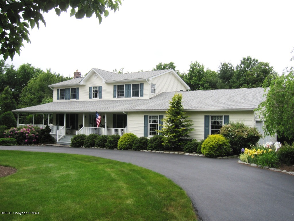 341 Tara Hill Road Bartonsville, PA 18321 - Photo 1 of 23 a front view of a house with garden