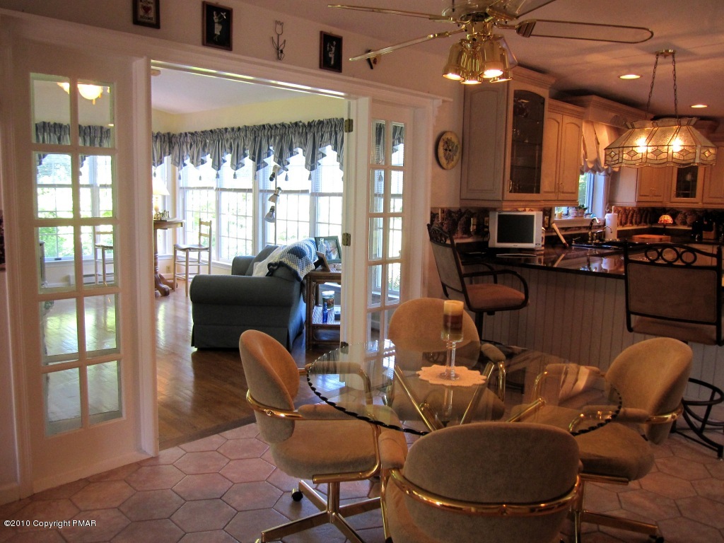 341 Tara Hill Road Bartonsville, PA 18321 - Photo 13 of 23 a view of a dining room with furniture and chandelier