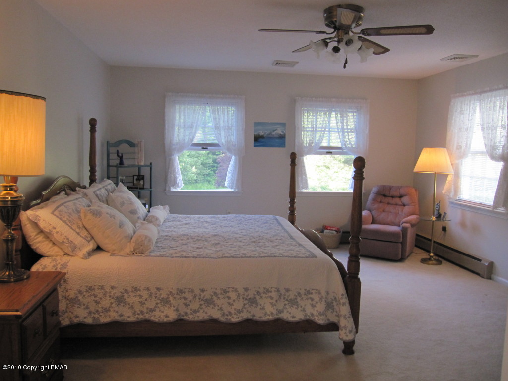 341 Tara Hill Road Bartonsville, PA 18321 - Photo 15 of 23 a bedroom with a bed window and a lamp