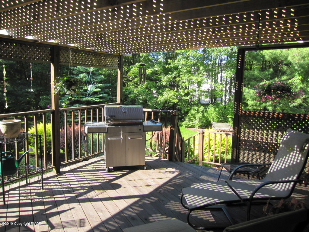 341 Tara Hill Road Bartonsville, PA 18321 - Photo 20 of 23 a view of a patio with a table chairs and backyard