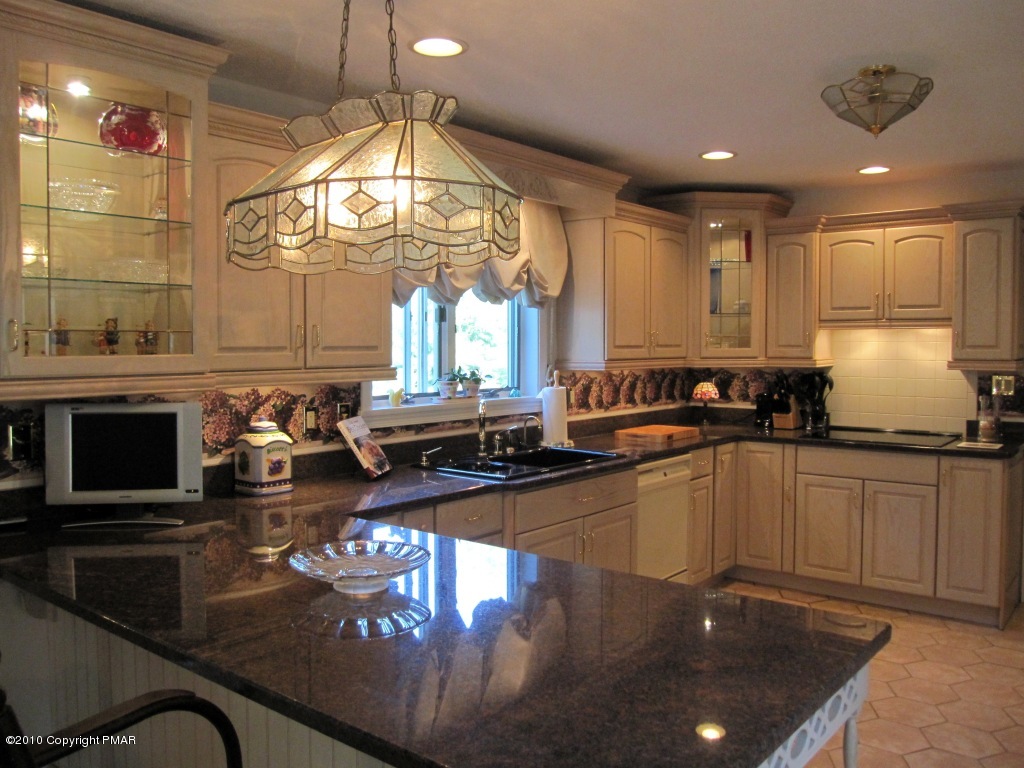 341 Tara Hill Road Bartonsville, PA 18321 - Photo 10 of 23 a kitchen with sink stove and cabinets