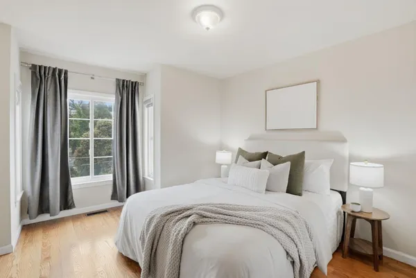a bedroom with a bed and a couch