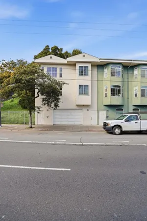 a view of a car parked in front of a house