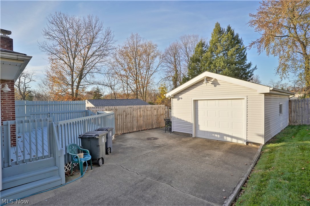 1627 Romona Road Akron, OH 44305 - Photo 27 of 35 Back deck, 1-1/2 car garage, extra parking space and part of fencing.